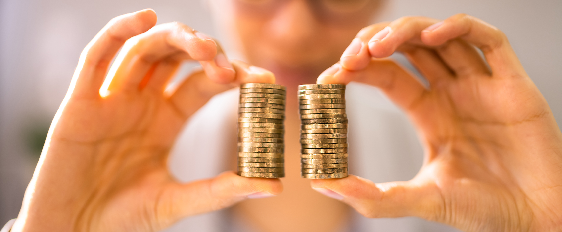 Image of a person holding coins