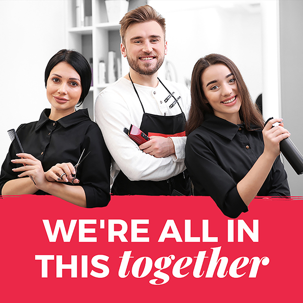 Two female stylists and one male stylist standing together