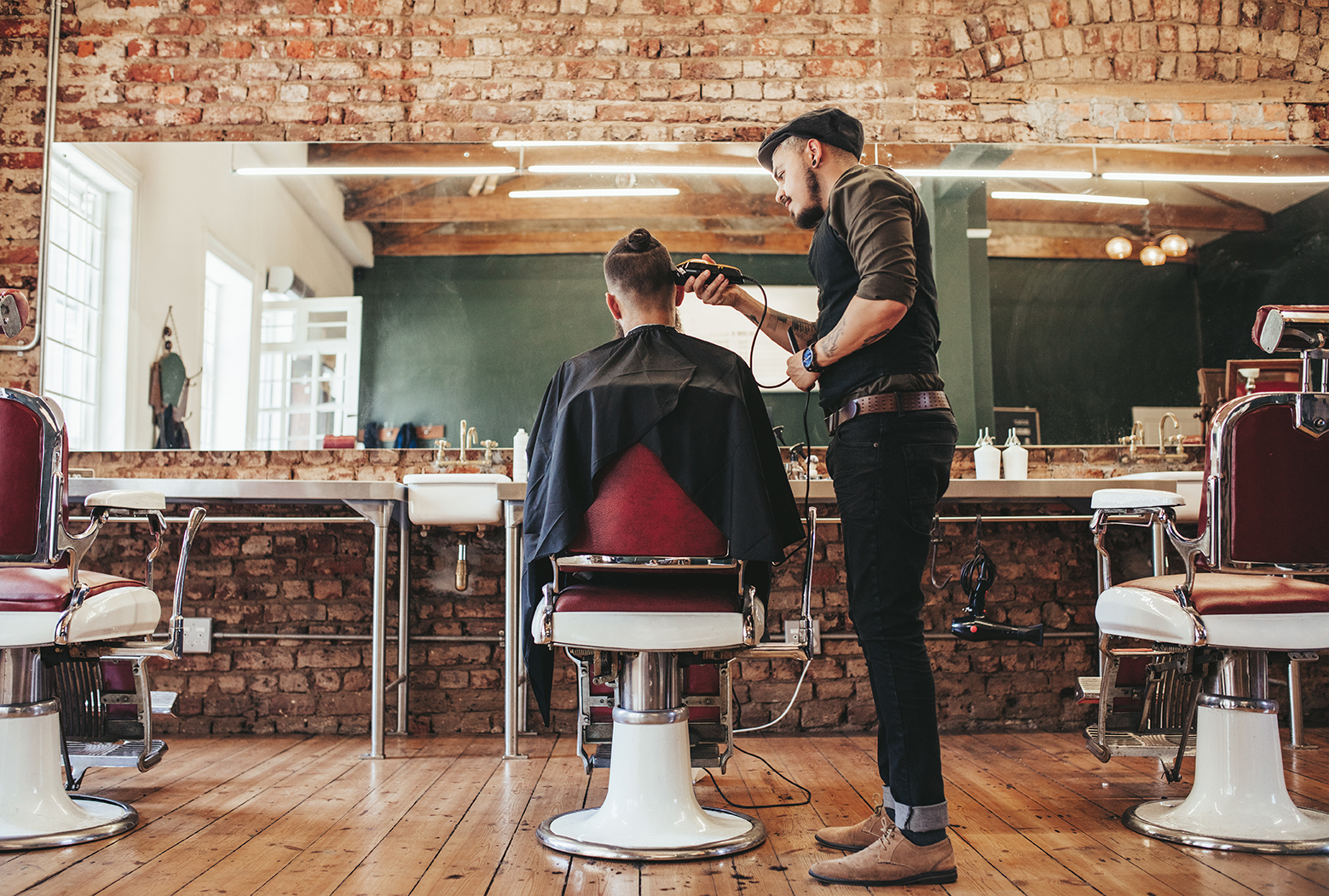 Image of barber giving haircut